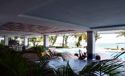 Large covered porch overlooking pool