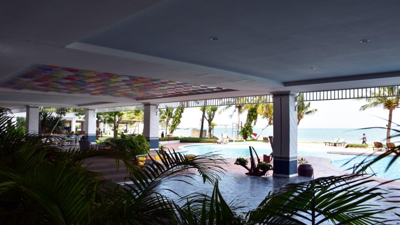 Large covered porch overlooking pool